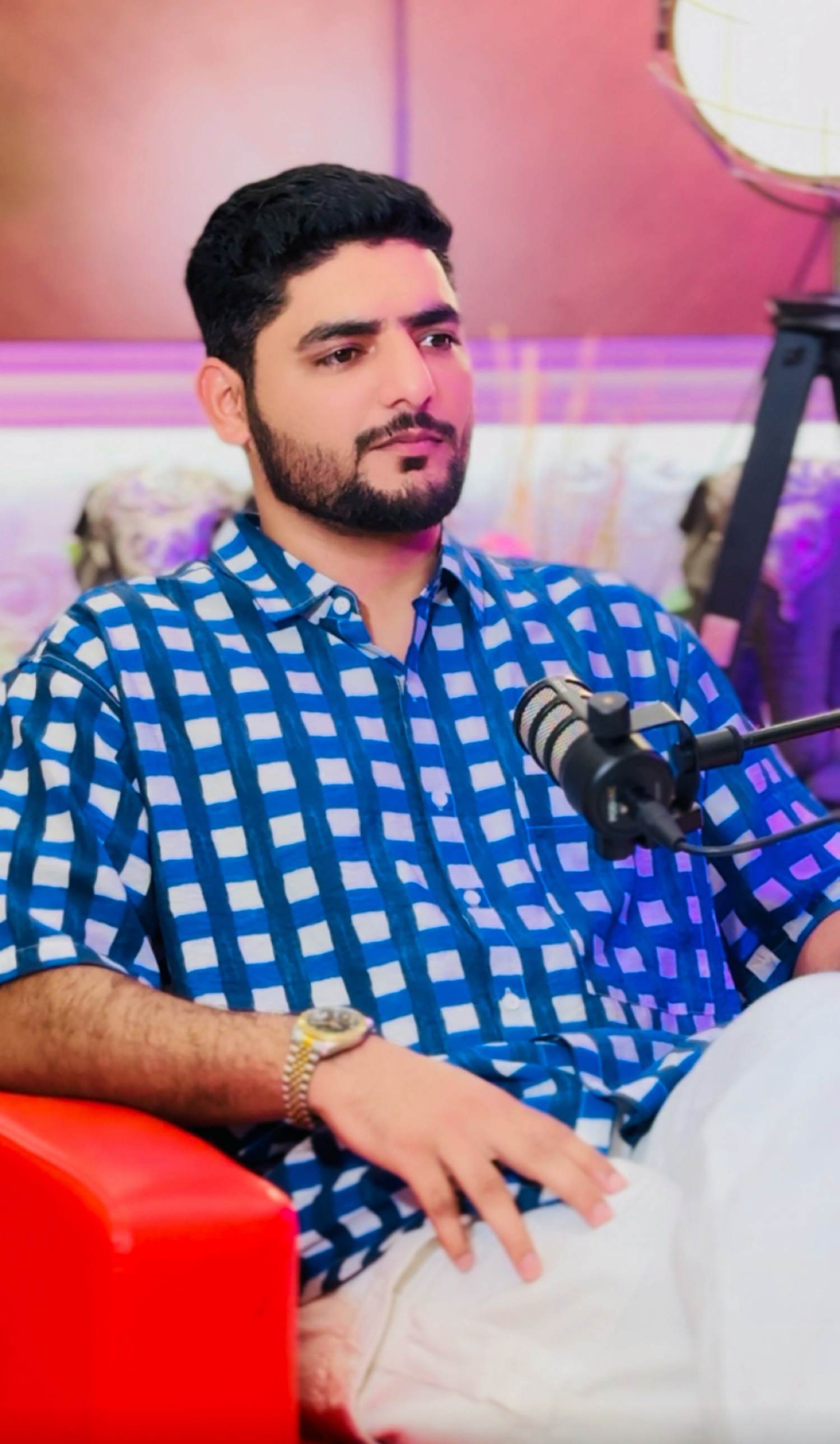 Qasim Shabir on a podcast set